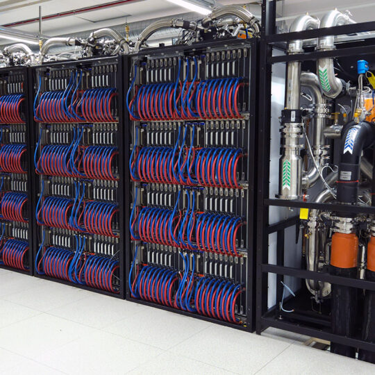 Supercomputer with GPU, CPU an cooling racks with blue and red cooling tubes