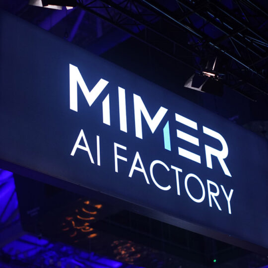 Elevated sign for Mimer AI Factory on dark blue background